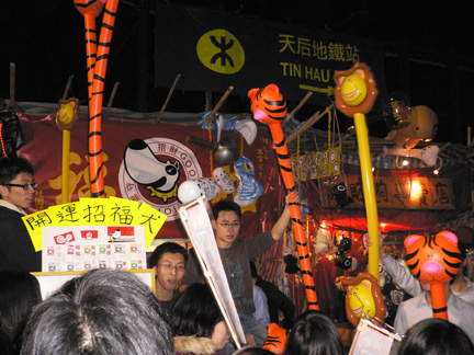 Hawkers selling inflatable animal staffs?