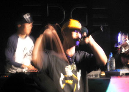 Chef spittin’ lyrics in Cantonese, while Qbert spins
