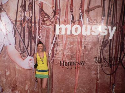 Carrie holding up the wall at the Moussy show